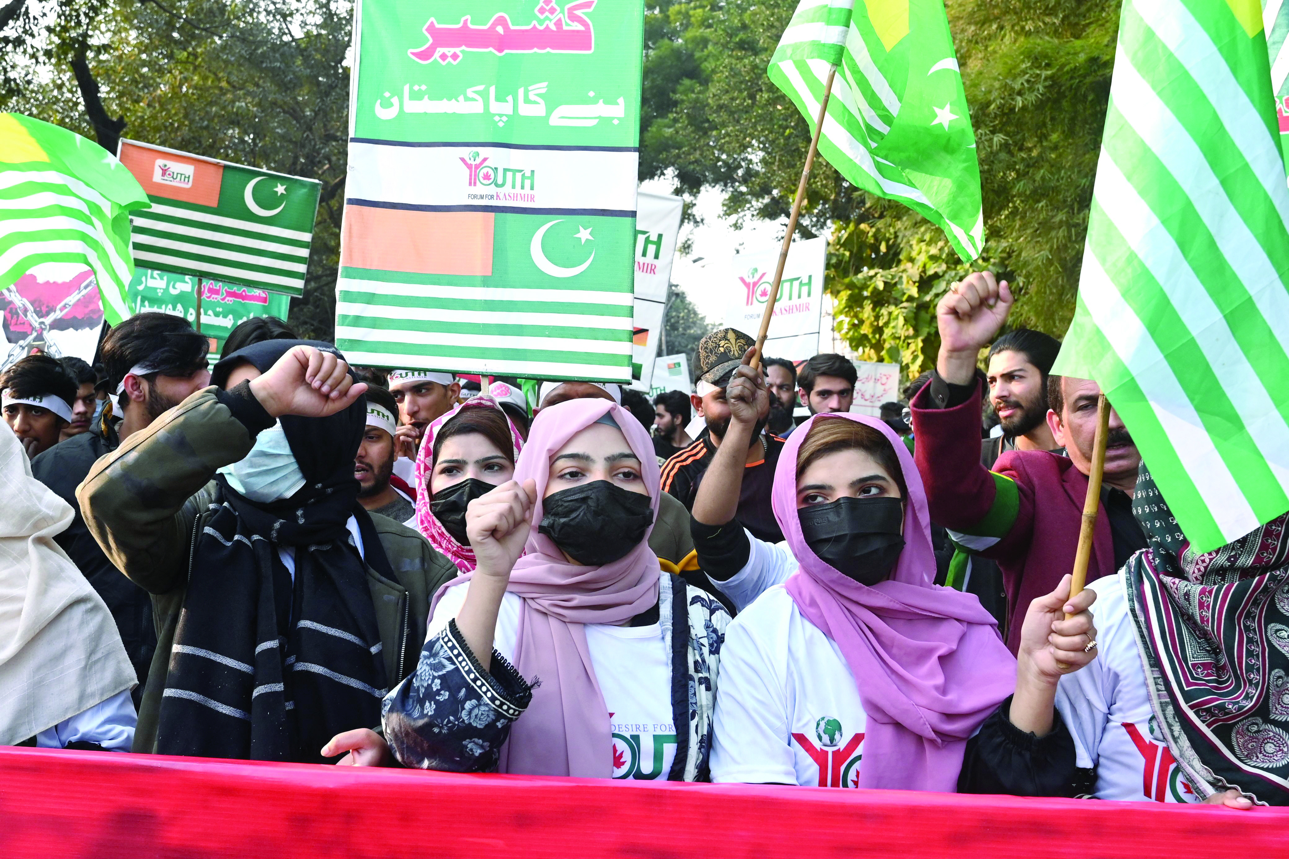 student activists display placards during a rally to mark kashmir solidarity day in lahore photo afp