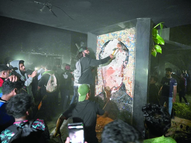 protesters destroy a mural of sheikh mujibur rahman father of former prime minister sheikh hasina in dhaka photo afp