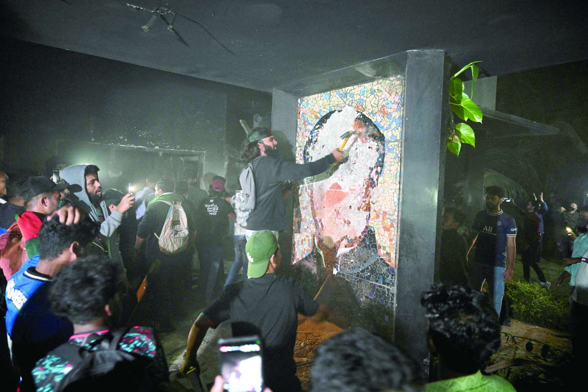 protesters destroy a mural of sheikh mujibur rahman father of former prime minister sheikh hasina in dhaka photo afp