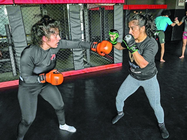 in this file photo anita karim r and bushra ahmed mixed martial arts mma fighters take part in a training session at a club in islamabad photo afp in this file photo anita karim r and bushra ahmed mixed martial arts mma fighters take part in a training session at a club in islamabad photo afp