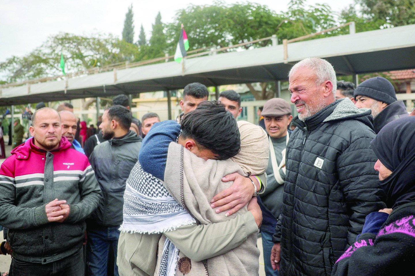 one of the palestinian prisoners released in the fifth hostage prisoner swap under the gaza ceasefire deal is embraced by his mother upon arrival at the european hospital in khan yunis in the southern gaza strip photo afp