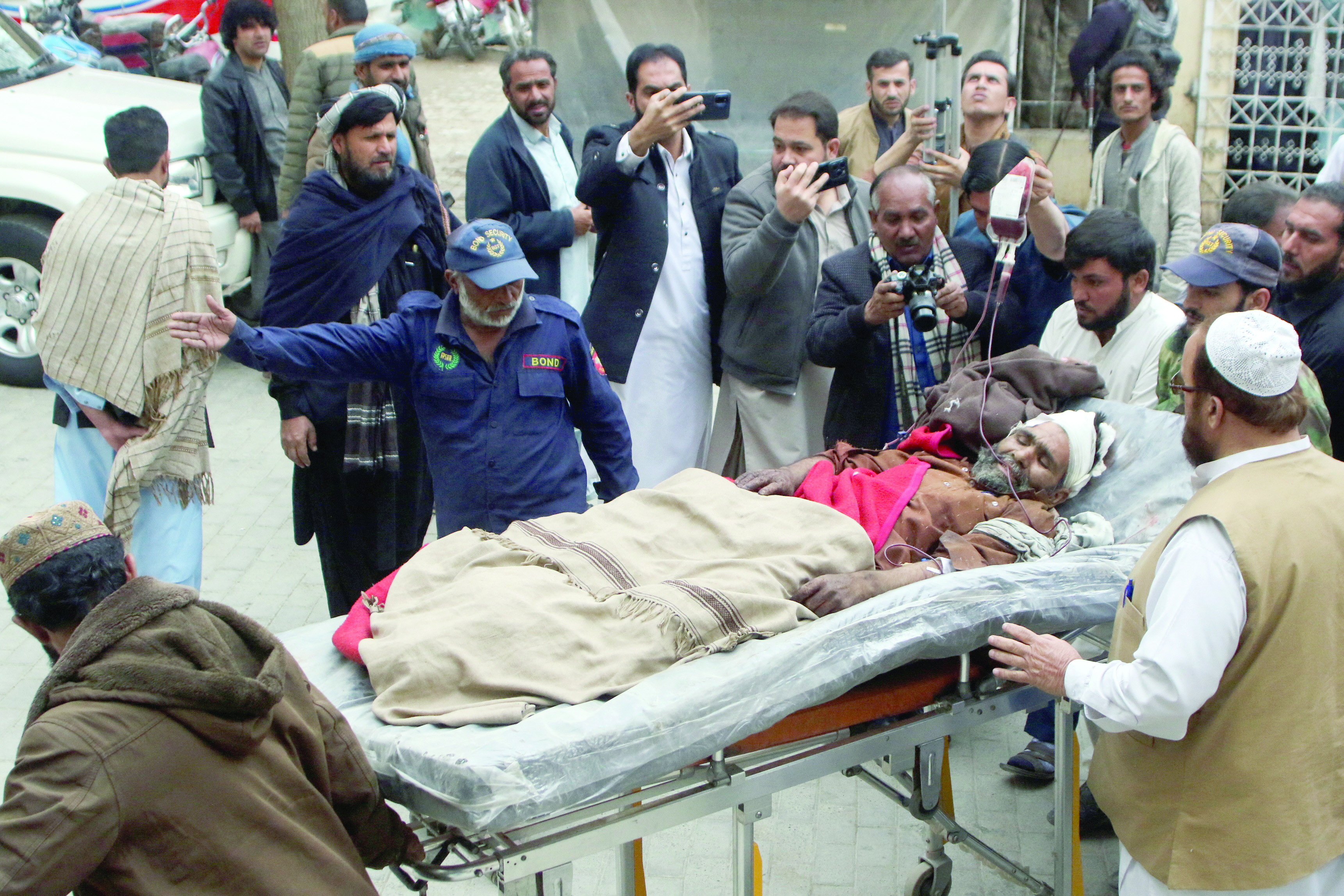 an injured labourer is brought to hospital in quetta following the harnai blast photo afp