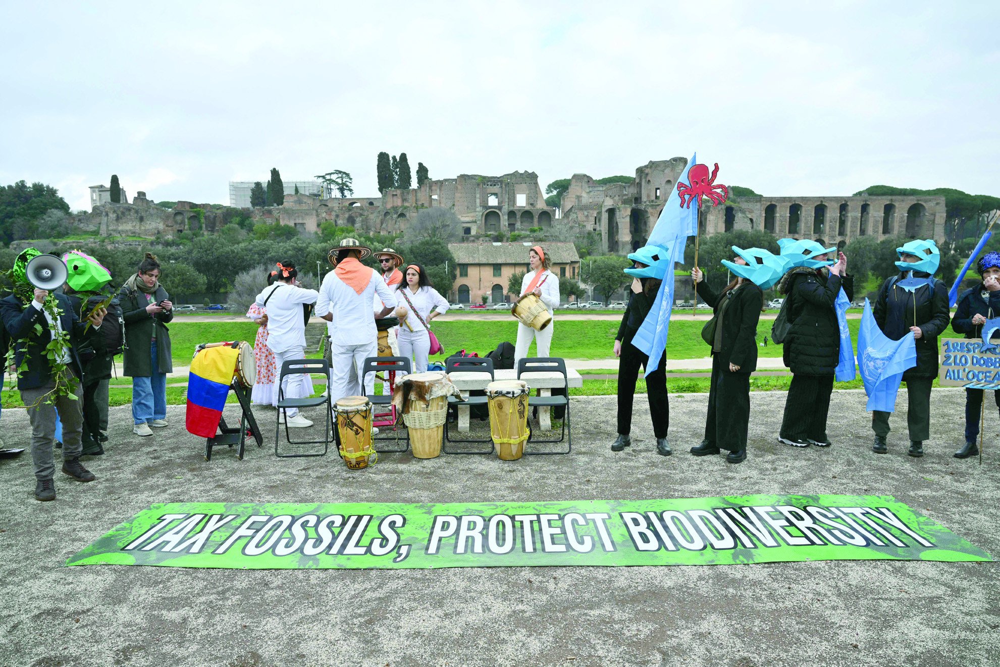 environmental activists take part in a flasmob at circo massimo at the un s food and agriculture organization headquarters in rome photo afp