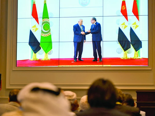 people watch on a big screen as egypt s president abdel fattah al sisi welcomes palestinian president mahmud abbas photo afp people watch on a big screen as egypt s president abdel fattah al sisi welcomes palestinian president mahmud abbas photo afp