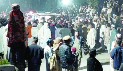 people gather near an ambulance outside a hospital in bannu photo reuters