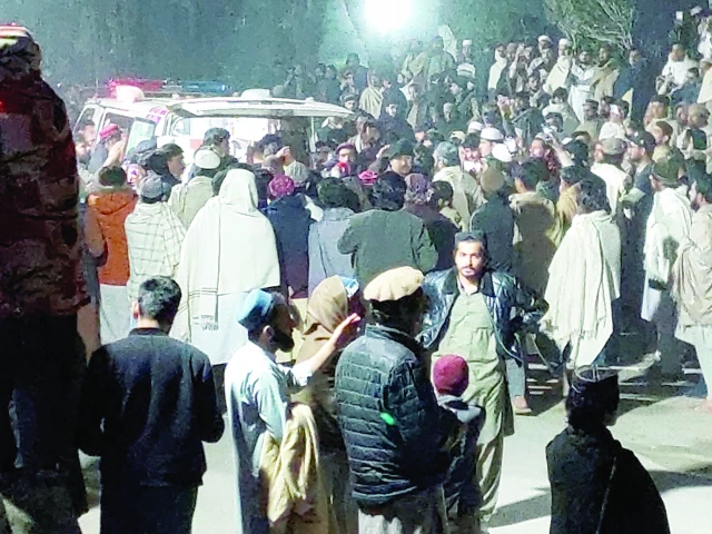 people gather near an ambulance outside a hospital in bannu photo reuters people gather near an ambulance outside a hospital in bannu photo reuters