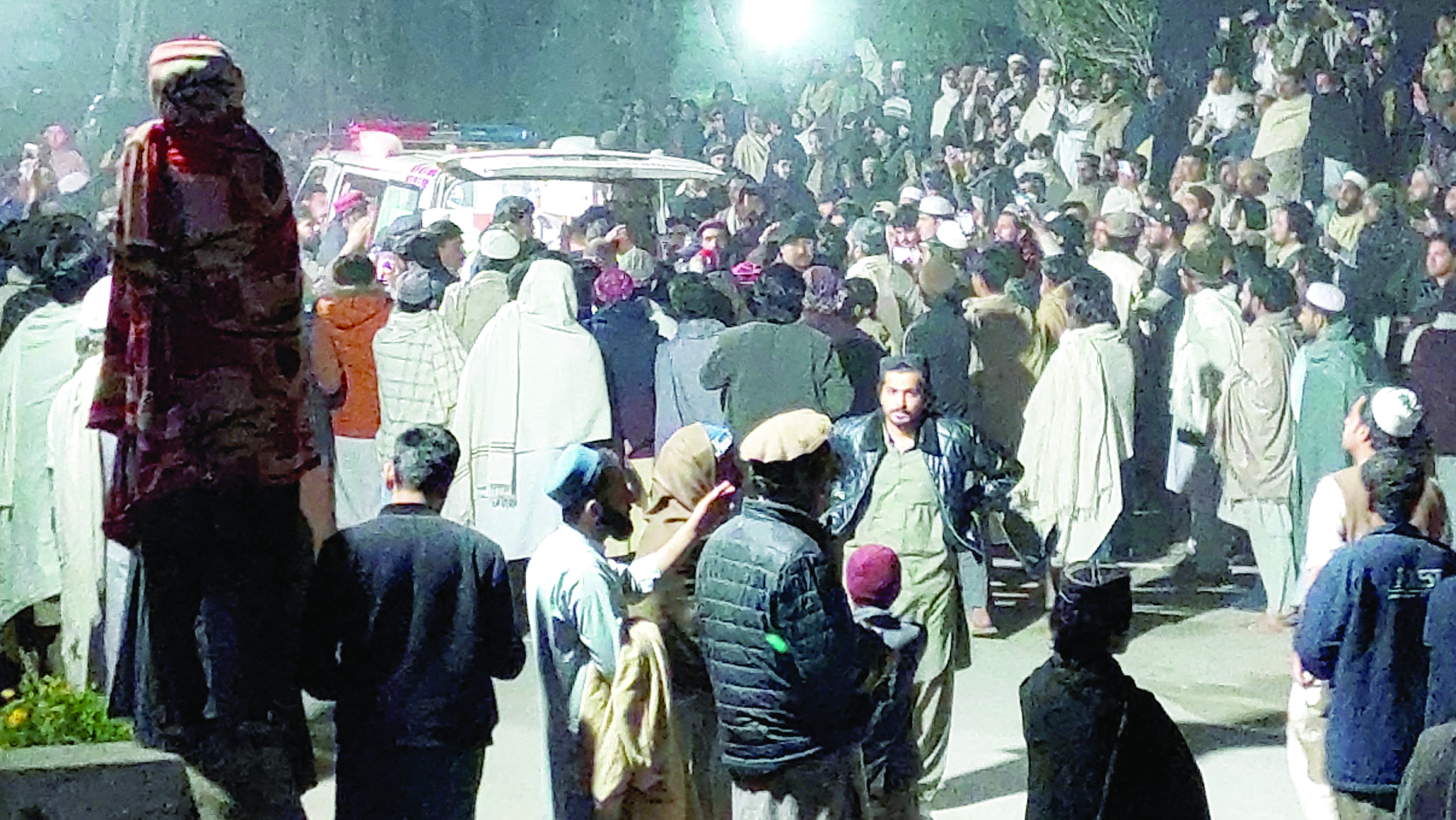 people gather near an ambulance outside a hospital in bannu photo reuters