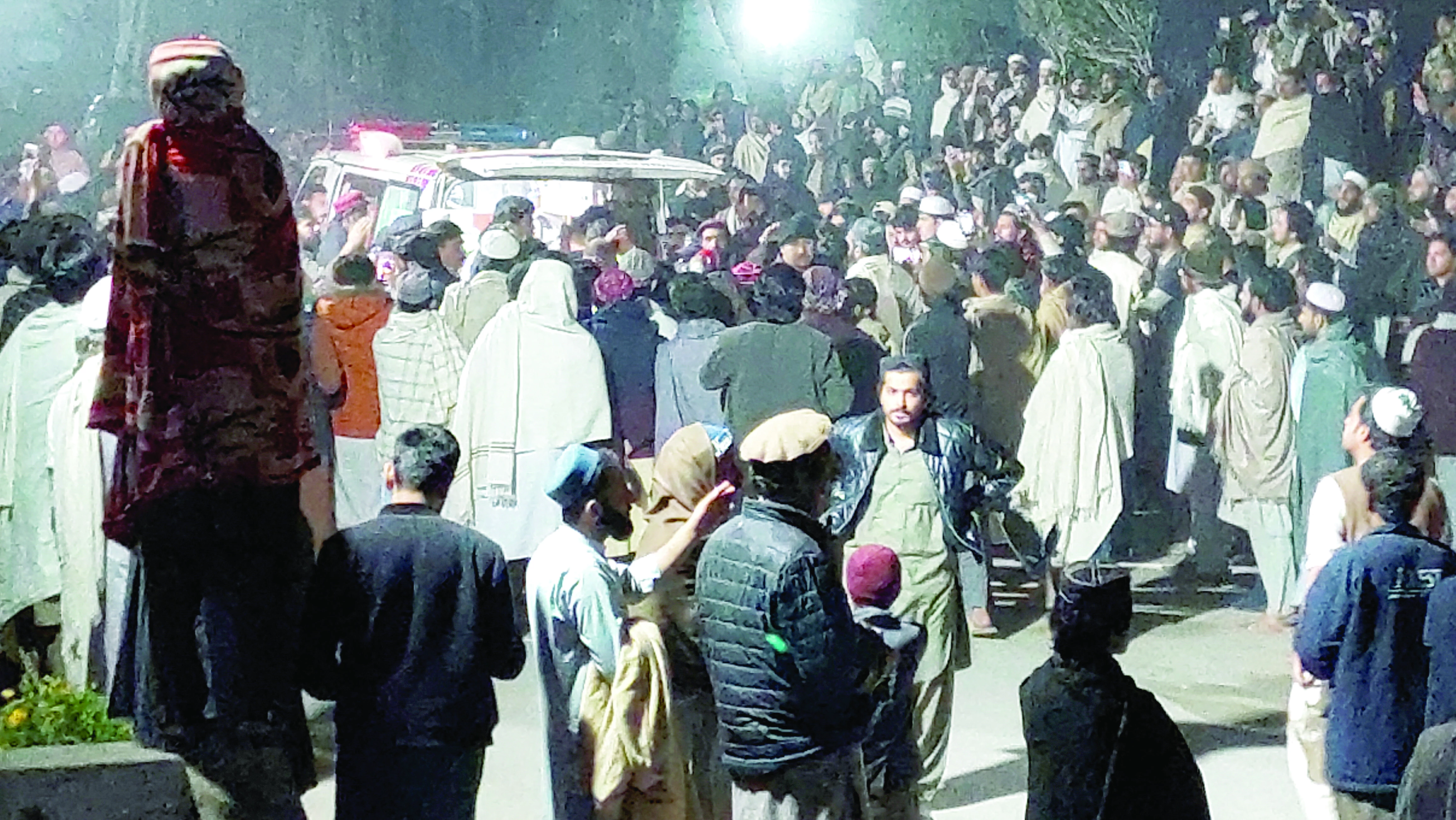 people gather near an ambulance outside a hospital in bannu photo reuters people gather near an ambulance outside a hospital in bannu photo reuters