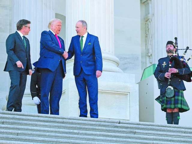 speaker of the house mike johnson r la us president donald trump and irish taoiseach micheal martin leave the us capitol in washington dc photo afp