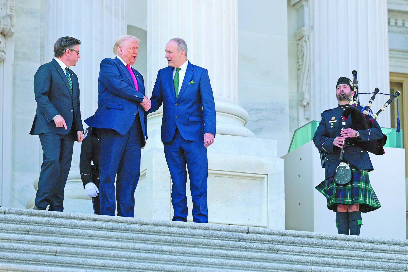 speaker of the house mike johnson r la us president donald trump and irish taoiseach micheal martin leave the us capitol in washington dc photo afp