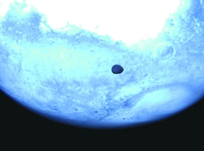 asteroid probe snaps rare pics of martian moon