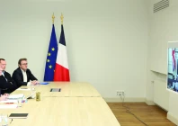 french president emmanuel macron attends a videocall as he takes part in a virtual summit held by britain s prime minister keir starmer on screen at the elysee palace in paris photo afp