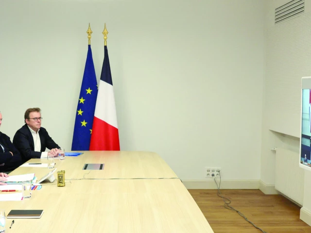 french president emmanuel macron attends a videocall as he takes part in a virtual summit held by britain s prime minister keir starmer on screen at the elysee palace in paris photo afp french president emmanuel macron attends a videocall as he takes part in a virtual summit held by britain s prime minister keir starmer on screen at the elysee palace in paris photo afp