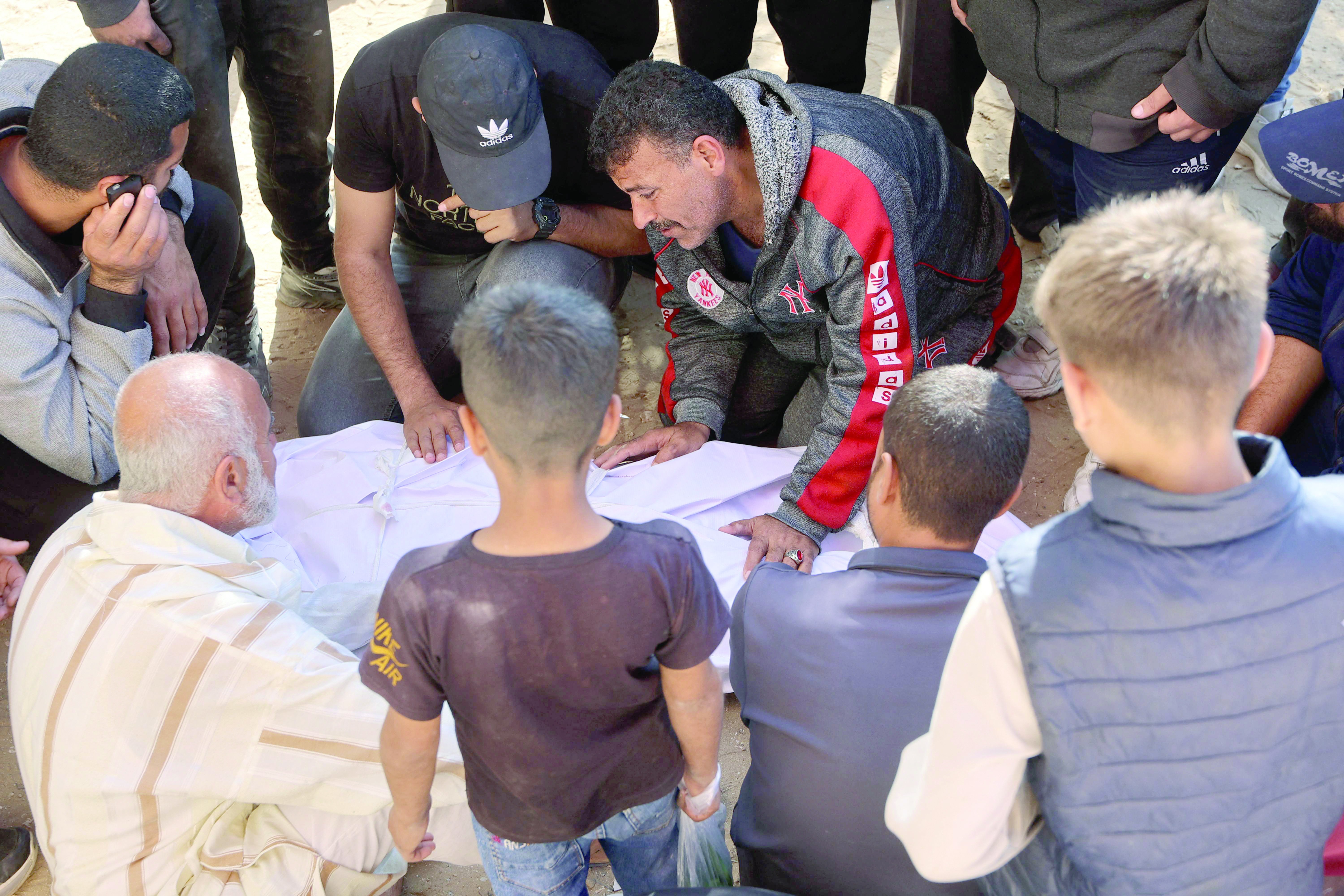 people mourns the death of one of the victims of israeli bombardment in beit lahia gaza strip photo afp