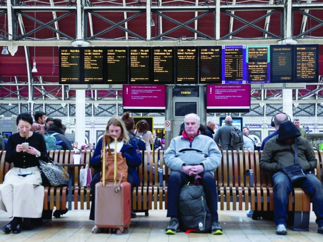 people wait at the paddington railway station after a fire at an electrical substation wiped out power at the heathrow international airport in london photo reuters people wait at the paddington railway station after a fire at an electrical substation wiped out power at the heathrow international airport in london photo reuters