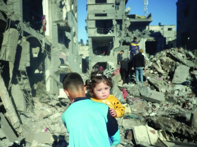 palestinian children react as they inspect the rubble and debris at the site of israeli strikes the night before at the nuseirat refugee camp in the central gaza strip photo afp palestinian children react as they inspect the rubble and debris at the site of israeli strikes the night before at the nuseirat refugee camp in the central gaza strip photo afp