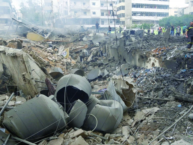 people gather at the site of an israeli strike in beirut photo afp people gather at the site of an israeli strike in beirut photo afp