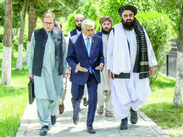 afghan foreign minister amir khan muttaqi walks with his pakistani counterpart ishaq dar in kabul photo afp afghan foreign minister amir khan muttaqi walks with his pakistani counterpart ishaq dar in kabul photo afp