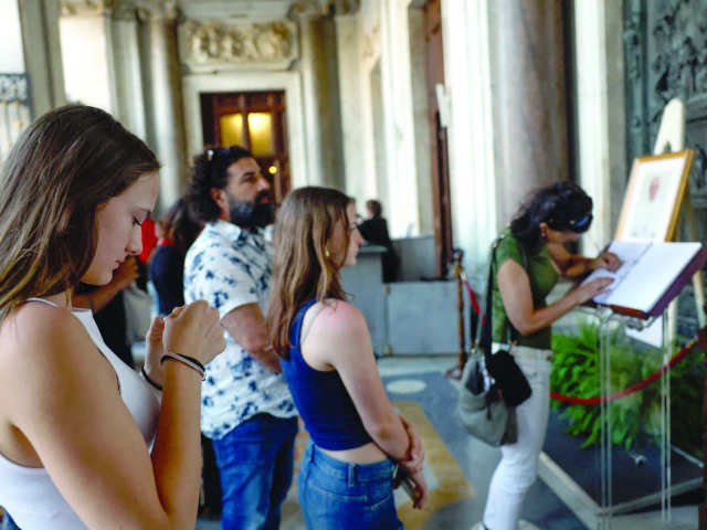 people line up to write a message in a condolence book for pope francis at the papal basilica of saint mary major santa maria maggiore where he will be buried in rome photo reuters people line up to write a message in a condolence book for pope francis at the papal basilica of saint mary major santa maria maggiore where he will be buried in rome photo reuters
