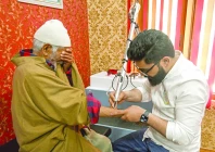 tabooed basit bashir a tattoo removal artist uses a laser machine to remove tattoos from the arm of a resident at his clinic in srinagar iiojk photo afp