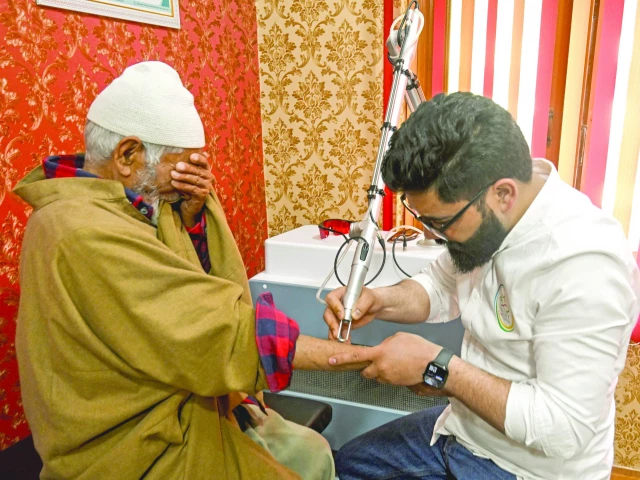 tabooed basit bashir a tattoo removal artist uses a laser machine to remove tattoos from the arm of a resident at his clinic in srinagar iiojk photo afp tabooed basit bashir a tattoo removal artist uses a laser machine to remove tattoos from the arm of a resident at his clinic in srinagar iiojk photo afp