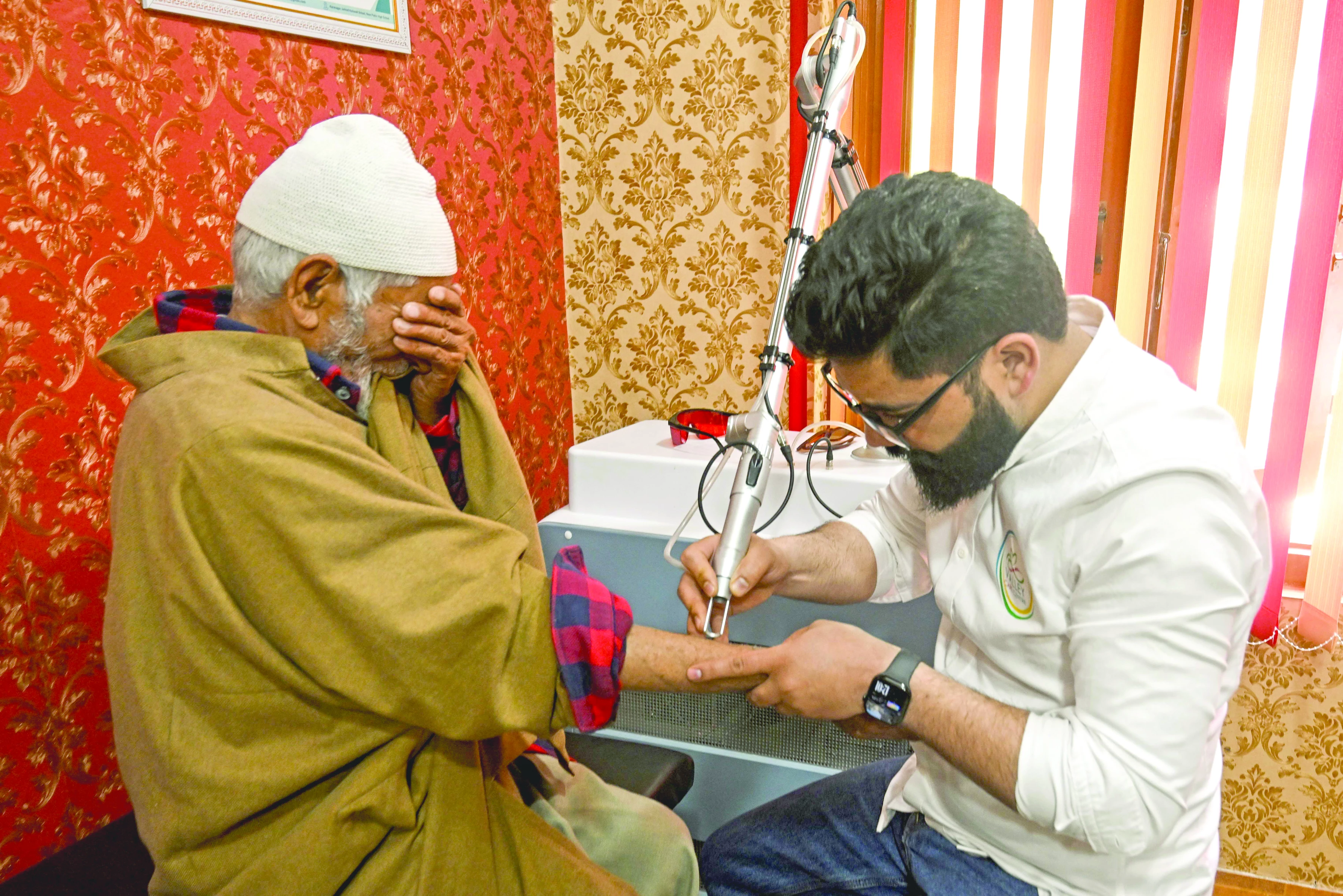 tabooed basit bashir a tattoo removal artist uses a laser machine to remove tattoos from the arm of a resident at his clinic in srinagar iiojk photo afp tabooed basit bashir a tattoo removal artist uses a laser machine to remove tattoos from the arm of a resident at his clinic in srinagar iiojk photo afp