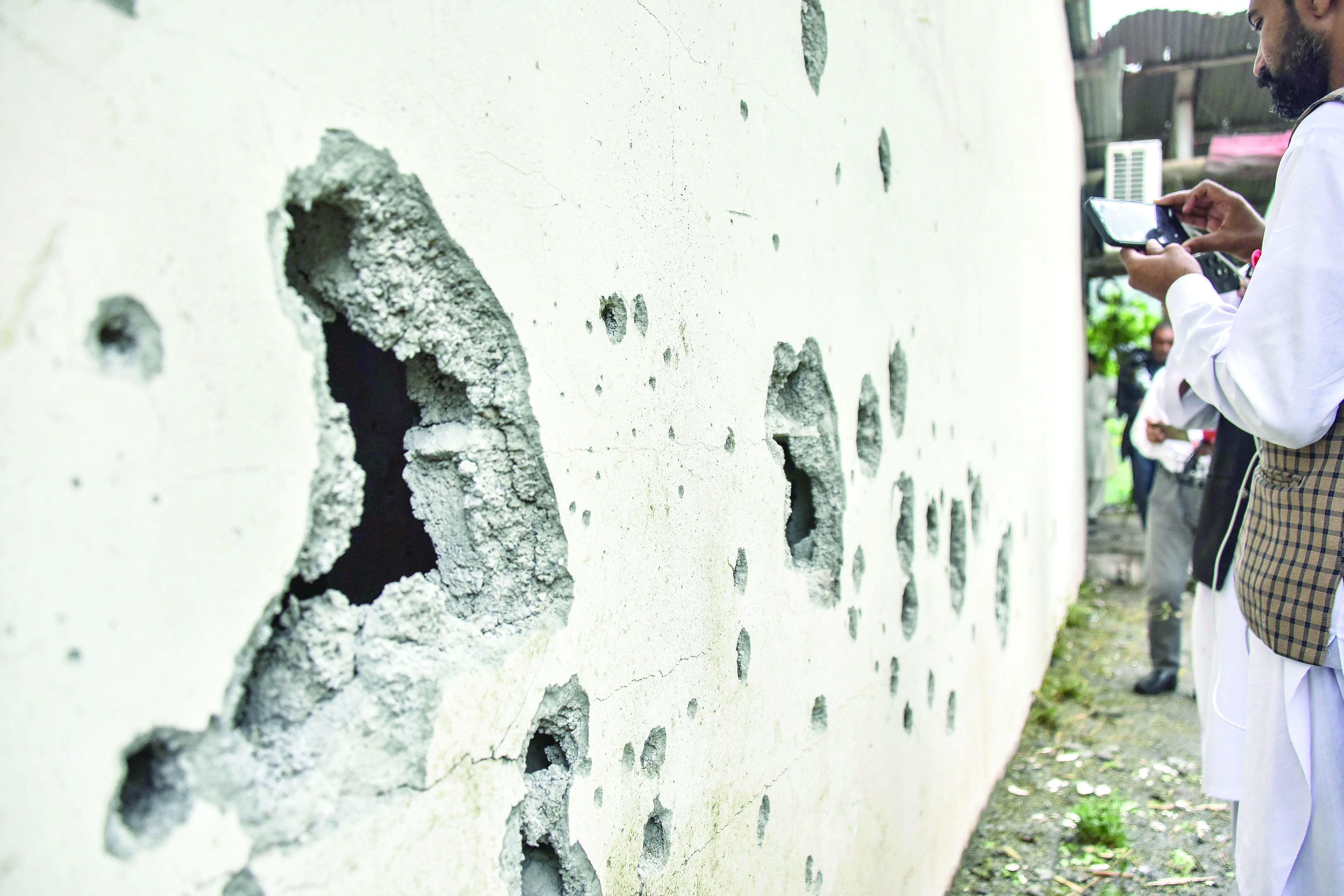 a partially damaged wall of the neelum jhelum hydropower project is pictured following an indian missile strike in nausari about 40km from muzaffarabad photo afp a partially damaged wall of the neelum jhelum hydropower project is pictured following an indian missile strike in nausari about 40km from muzaffarabad photo afp