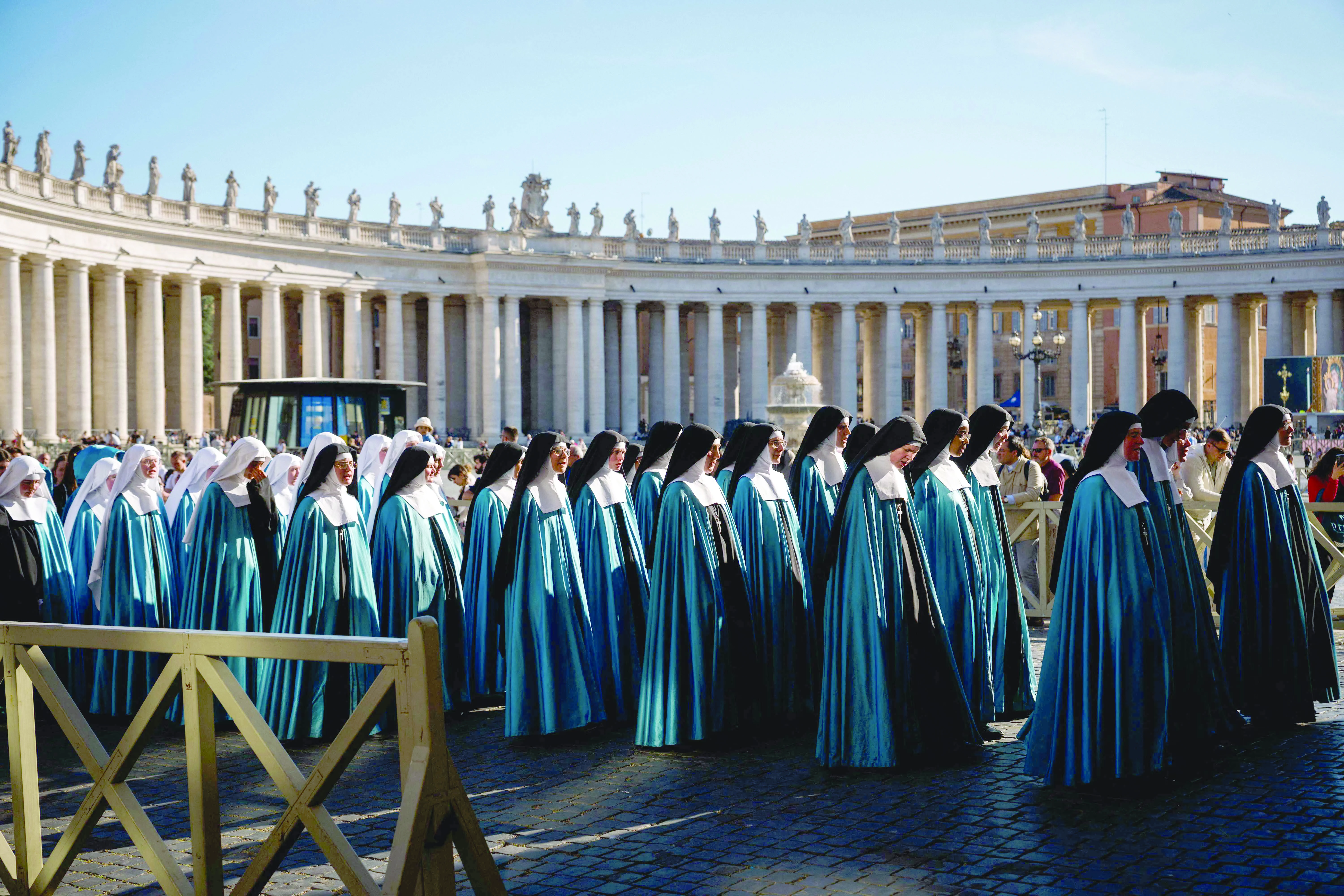 pilgrims from the sister adorers of the royal heart of jesus a society of apostolic life take part in a procession on st peter s square with the colonnade in the background in the vatican photo afp pilgrims from the sister adorers of the royal heart of jesus a society of apostolic life take part in a procession on st peter s square with the colonnade in the background in the vatican photo afp