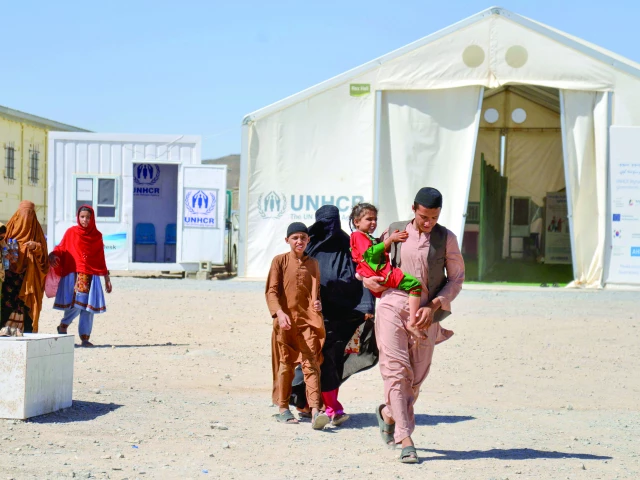 afghans walk after their arrival from pakistan in takhta pul photo afp afghans walk after their arrival from pakistan in takhta pul photo afp