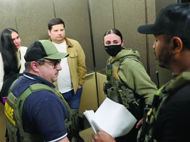 federal agents detain an individual after their hearing in an immigration court in new york city photo afp federal agents detain an individual after their hearing in an immigration court in new york city photo afp