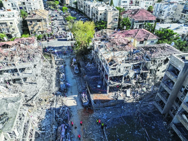 a drone photo shows the damage over residential homes at the impact site in ramat gan israel photo reuters a drone photo shows the damage over residential homes at the impact site in ramat gan israel photo reuters