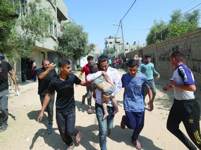 palestinians rush a wounded child in al bureij camp in the central gaza strip photo afp palestinians rush a wounded child in al bureij camp in the central gaza strip photo afp