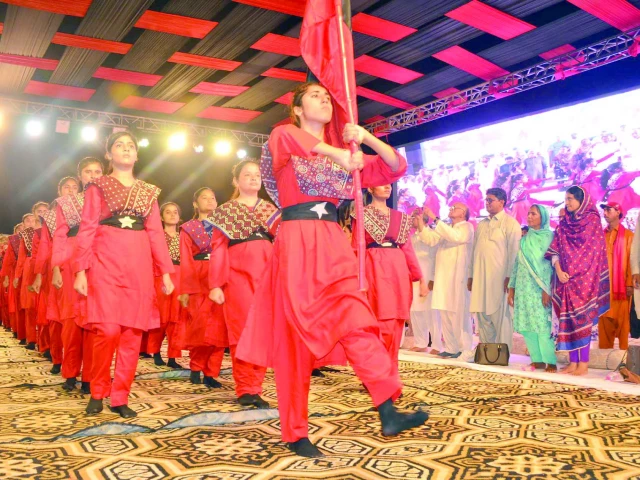 brandishing the red flag girls in red uniform perform a march past at the death anniversary of revolutionary leader rasool bux palijo photo express brandishing the red flag girls in red uniform perform a march past at the death anniversary of revolutionary leader rasool bux palijo photo express