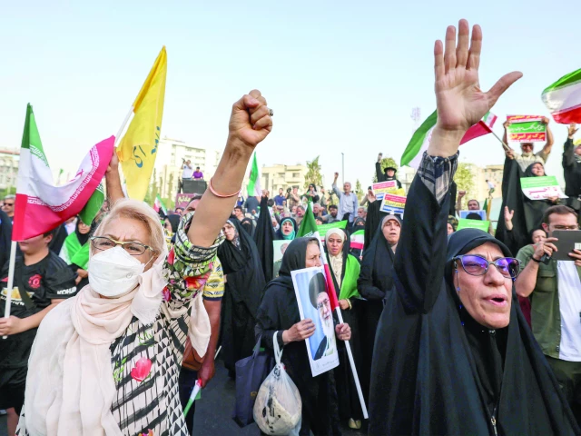 iranians wave national flags as they celebrate a ceasefire between iran and israel at enghlab square in tehran photo afp iranians wave national flags as they celebrate a ceasefire between iran and israel at enghlab square in tehran photo afp
