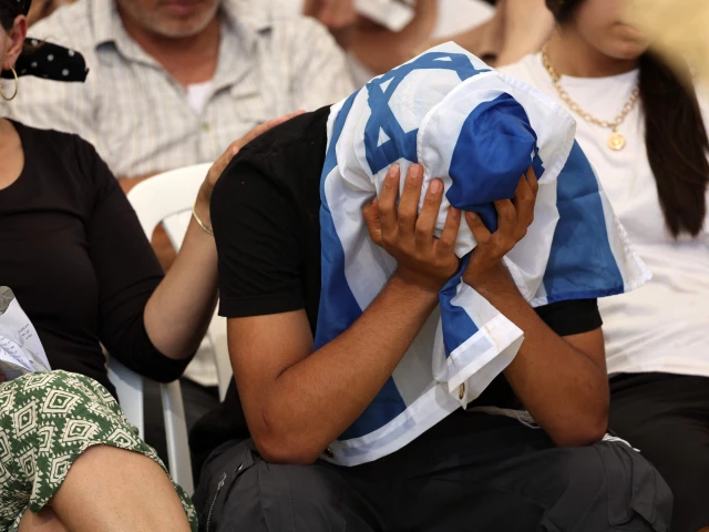 a young man covers his head with an israeli flag as he mourns ronel ben moshe a soldier killed in the gaza strip the day before during his funeral in rehovot on june 25 2026 seven israeli soldiers were killed in gaza after an attack on their armoured vehicle israel said on june 25 in one of the deadliest incidents for its forces in the more than 20 month war photo afp a young man covers his head with an israeli flag as he mourns ronel ben moshe a soldier killed in the gaza strip the day before during his funeral in rehovot on june 25 2026 seven israeli soldiers were killed in gaza after an attack on their armoured vehicle israel said on june 25 in one of the deadliest incidents for its forces in the more than 20 month war photo afp