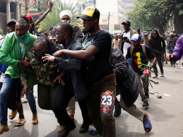 protesters remove a police officer after a clash during demonstrations to mark the first anniversary of the deadly 2024 anti government protests that drew widespread condemnation over the use of force by security agencies in nairobi kenya june 25 2025 photo reuters protesters remove a police officer after a clash during demonstrations to mark the first anniversary of the deadly 2024 anti government protests that drew widespread condemnation over the use of force by security agencies in nairobi kenya june 25 2025 photo reuters