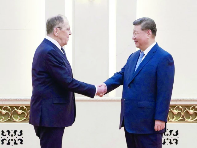 china s president xi jinping shakes hands with russian foreign minister sergey lavrov in beijing photo afp china s president xi jinping shakes hands with russian foreign minister sergey lavrov in beijing photo afp