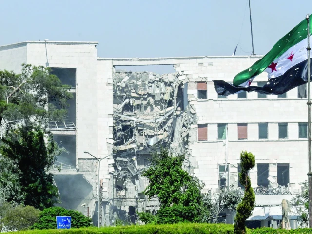 the picture shows the heavily damaged syrian army and defence ministry headquarters in damascus photo afp