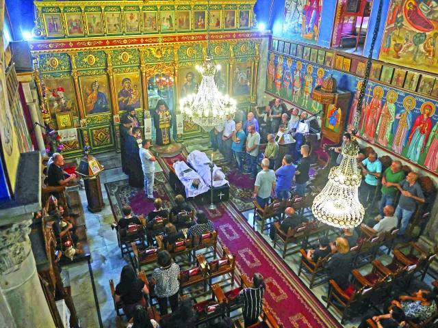 people attend the funeral ceremony of two christian palestinians killed earlier in gaza photo afp