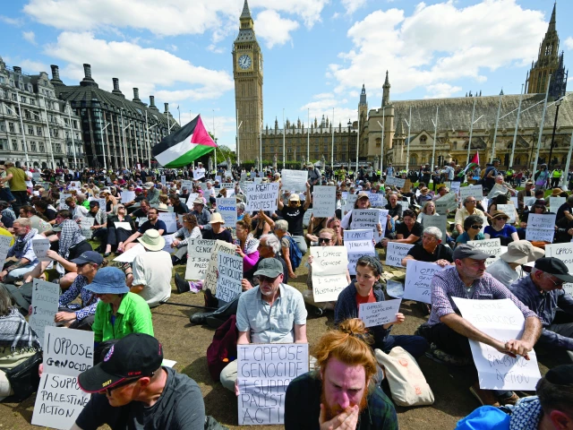 protesters pack parliament square in london rallying in solidarity with the palestine action group and calling out government policies they say enable oppression photo reuters