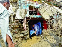 a resident clears sludge from his damaged house a day after flash floods in buner the district remains the hardest hit by recent monsoon rains in khyber pakhtunkhwa photo afp a resident clears sludge from his damaged house a day after flash floods in buner the district remains the hardest hit by recent monsoon rains in khyber pakhtunkhwa photo afp