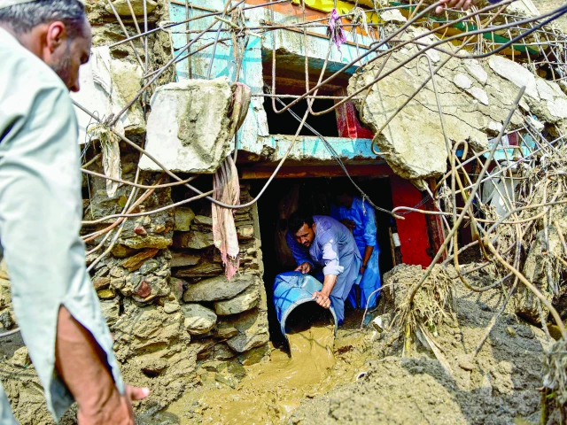a resident clears sludge from his damaged house a day after flash floods in buner the district remains the hardest hit by recent monsoon rains in khyber pakhtunkhwa with 337 deaths reported so far photo afp a resident clears sludge from his damaged house a day after flash floods in buner the district remains the hardest hit by recent monsoon rains in khyber pakhtunkhwa with 337 deaths reported so far photo afp