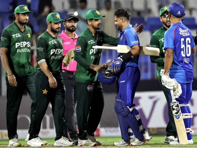 pakistan and afghanistan s players shake hands at the end of their uae tri series match in sharjah photo afp pakistan and afghanistan s players shake hands at the end of their uae tri series match in sharjah photo afp