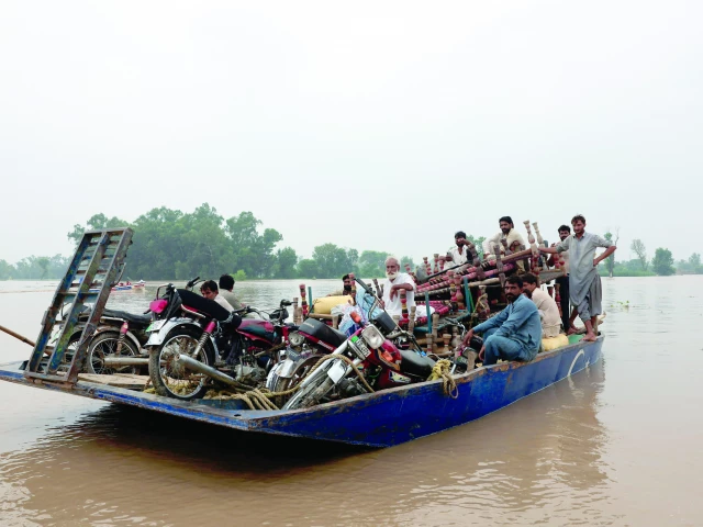 residents travel with their belongings on a boat as they head towards higher ground following the monsoon rains and rising water level of the sutlej river photo reuters residents travel with their belongings on a boat as they head towards higher ground following the monsoon rains and rising water level of the sutlej river photo reuters