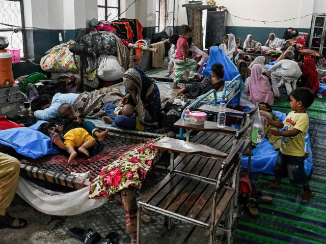 flood affected victims rest at a makeshift relief camp inside a school in lahore on september 1 2025 nearly half a million people have been displaced by flooding in eastern pakistan after days of heavy rain swelled rivers photo afp flood affected victims rest at a makeshift relief camp inside a school in lahore on september 1 2025 nearly half a million people have been displaced by flooding in eastern pakistan after days of heavy rain swelled rivers photo afp