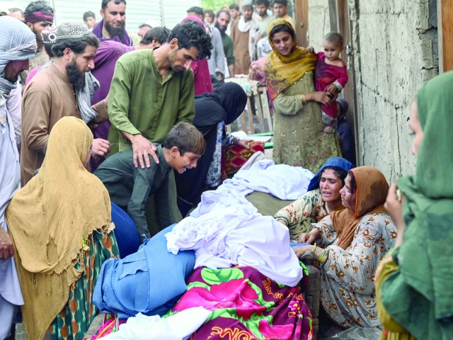 relatives of victims mourn outside a damaged house following earthquakes in the mazar dara village of nurgal a district of the kunar province photo afp relatives of victims mourn outside a damaged house following earthquakes in the mazar dara village of nurgal a district of the kunar province photo afp