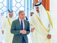qatari emir sheikh tamim bin hamad al thani with prime minister shehbaz sharif in doha photo afp file