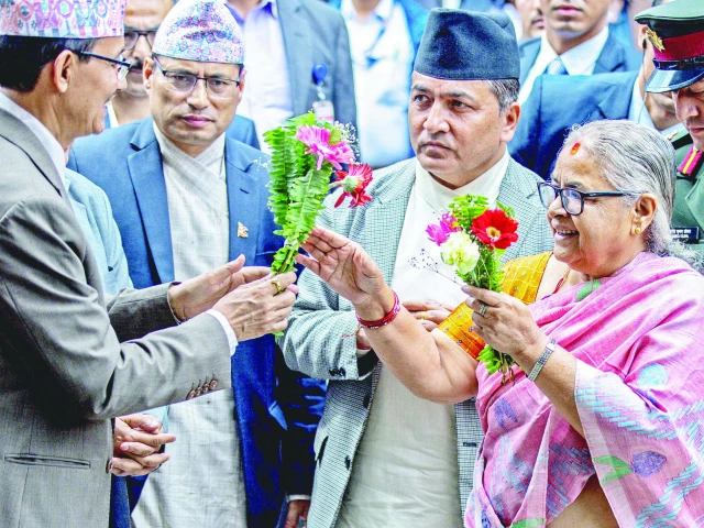 officials greet newly elected prime minister of nepal s interim government sushila karki as she arrives at the pm s office in kathmandu photo afp officials greet newly elected prime minister of nepal s interim government sushila karki as she arrives at the pm s office in kathmandu photo afp