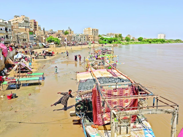 a woman hops to her family s boat on the bank of the indus river as floodwater surges following monsoon rains and rising water levels in sukkur photo reuters a woman hops to her family s boat on the bank of the indus river as floodwater surges following monsoon rains and rising water levels in sukkur photo reuters