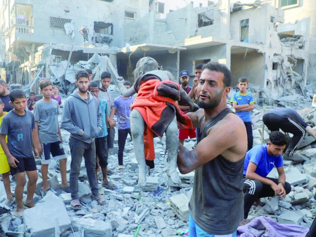 a man carries the body of palestinian girl amal zakot who was killed in an israeli strike on a house in gaza city photo reuters a man carries the body of palestinian girl amal zakot who was killed in an israeli strike on a house in gaza city photo reuters
